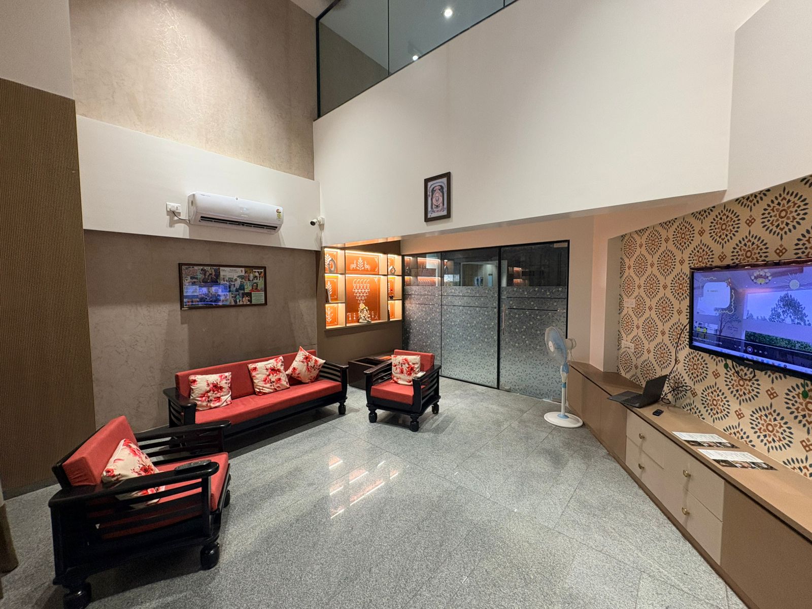 Double-height lounge with seating and traditional decor
